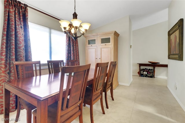 3207 Horse Carriage Way Unit 406, Naples, FL 34105 - dining area with a chandelier, baseboards, and light tile patterned flooring