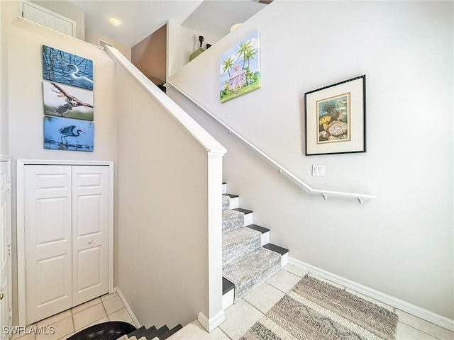 14641 Glen Cove Dr Unit 1704, Fort Myers, FL 33919 - stairs featuring baseboards and tile patterned flooring