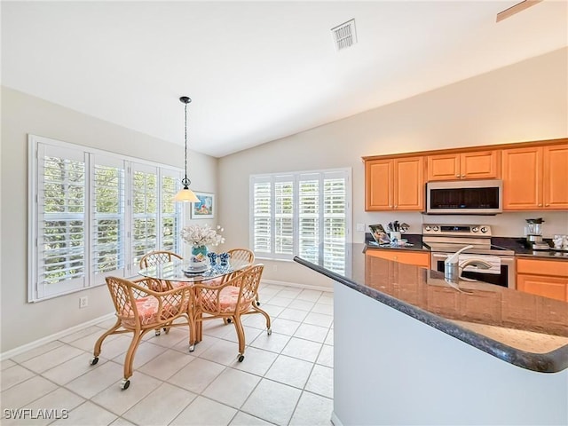 14641 Glen Cove Dr Unit 1704, Fort Myers, FL 33919 - kitchen featuring decorative light fixtures, lofted ceiling, stainless steel appliances, light tile patterned flooring, and visible vents