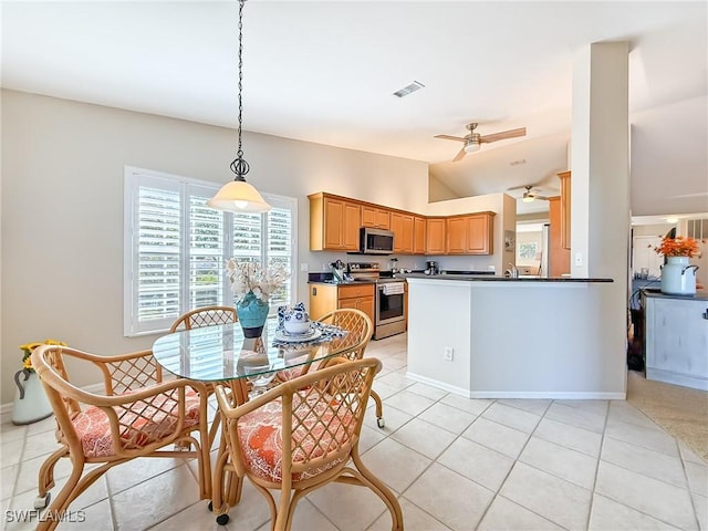 14641 Glen Cove Dr Unit 1704, Fort Myers, FL 33919 - dining room featuring lofted ceiling, light tile patterned floors, baseboards, ceiling fan, and visible vents