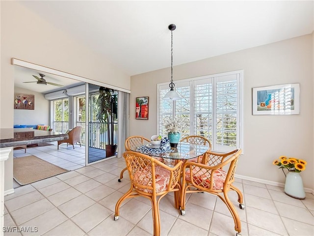 14641 Glen Cove Dr Unit 1704, Fort Myers, FL 33919 - dining room featuring baseboards, a ceiling fan, vaulted ceiling, and light tile patterned floors