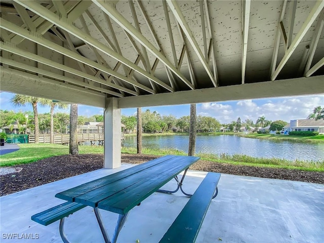 14641 Glen Cove Dr Unit 1704, Fort Myers, FL 33919 - view of patio with a water view and fence