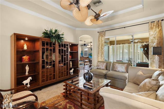 tiled living area featuring visible vents, ceiling fan, and a raised ceiling