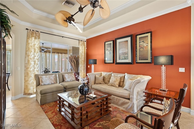 living area with crown molding, visible vents, ceiling fan, and light tile patterned flooring
