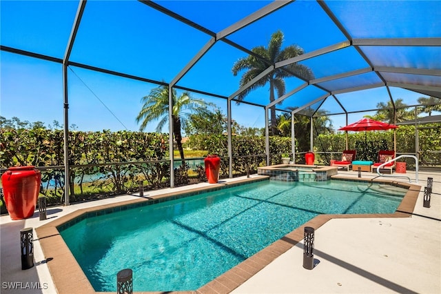 view of pool with a patio, a pool with connected hot tub, and glass enclosure