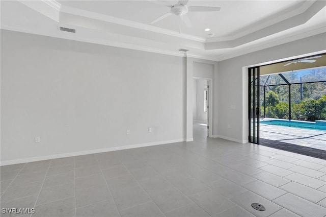 2967 Amblewind Dr, Fort Myers, FL 33905 - unfurnished room featuring a tray ceiling, ceiling fan, crown molding, tile patterned floors, and recessed lighting