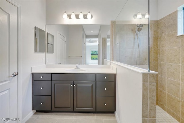 2967 Amblewind Dr, Fort Myers, FL 33905 - bathroom with a walk in shower, vanity, baseboards, and tile patterned flooring