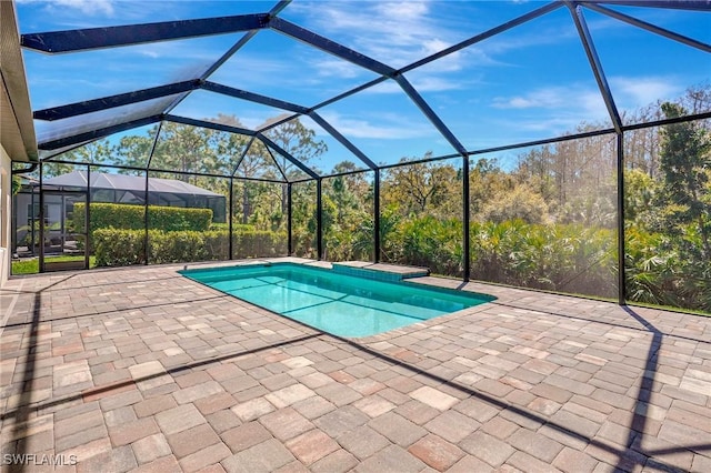 2967 Amblewind Dr, Fort Myers, FL 33905 - outdoor pool with a patio area and glass enclosure