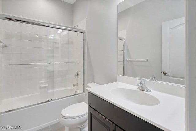 2967 Amblewind Dr, Fort Myers, FL 33905 - full bathroom featuring toilet, vanity, and bath / shower combo with glass door
