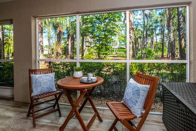 1702 Kings Lake Blvd Unit 103, Naples, FL 34112 - sunroom / solarium featuring plenty of natural light