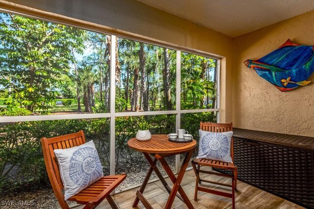 1702 Kings Lake Blvd Unit 103, Naples, FL 34112 - view of sunroom / solarium