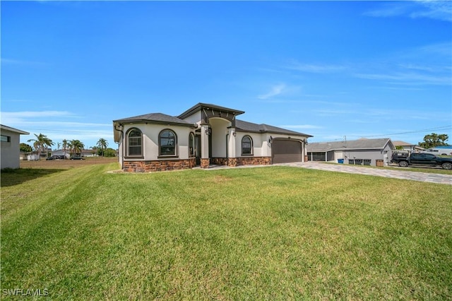 view of front of house with stucco siding, a garage, driveway, stone siding, and a front lawn