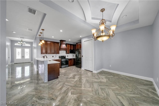 kitchen with an inviting chandelier, fridge with ice dispenser, black microwave, stainless steel range with electric stovetop, and premium range hood