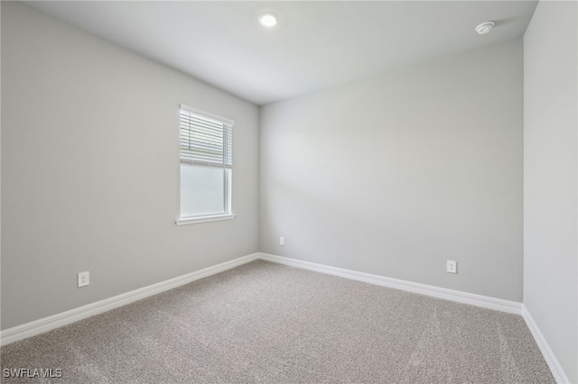 44385 Frontier Dr, Punta Gorda, FL 33982 - carpeted empty room featuring baseboards and a smoke detector