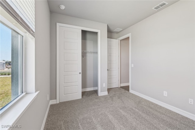 44385 Frontier Dr, Punta Gorda, FL 33982 - unfurnished bedroom featuring carpet, a closet, and baseboards