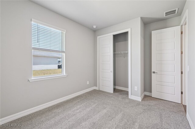 44385 Frontier Dr, Punta Gorda, FL 33982 - unfurnished bedroom featuring carpet floors, a closet, and baseboards