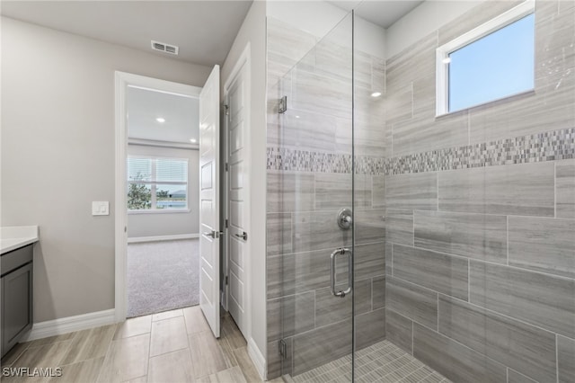 44385 Frontier Dr, Punta Gorda, FL 33982 - bathroom featuring vanity, baseboards, and a stall shower