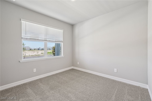 44385 Frontier Dr, Punta Gorda, FL 33982 - spare room featuring carpet flooring and baseboards