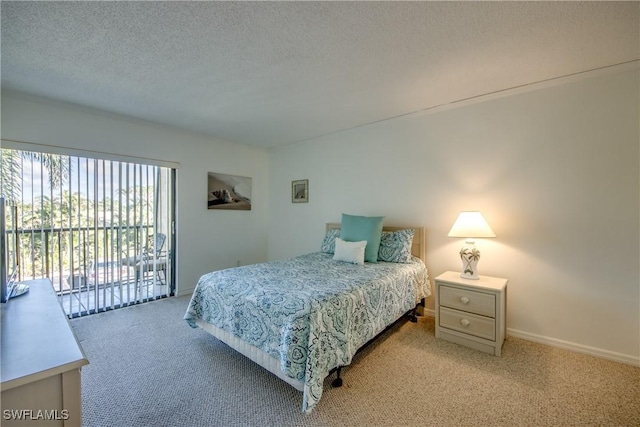 bedroom with access to exterior, light colored carpet, baseboards, and a textured ceiling