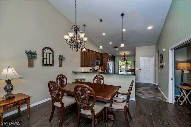 12090 Kelly Greens Blvd Unit 119, Fort Myers, FL 33908 - dining area featuring baseboards, high vaulted ceiling, a chandelier, and wood tiled floor