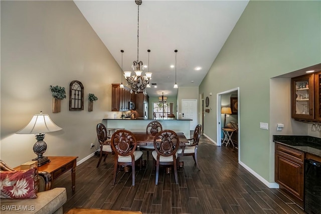12090 Kelly Greens Blvd Unit 119, Fort Myers, FL 33908 - dining area featuring high vaulted ceiling, baseboards, an inviting chandelier, and wood finish floors