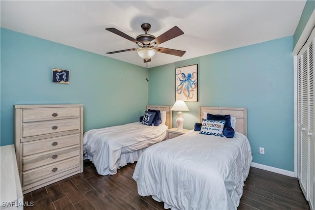 12090 Kelly Greens Blvd Unit 119, Fort Myers, FL 33908 - bedroom with a closet, baseboards, a ceiling fan, and wood finish floors