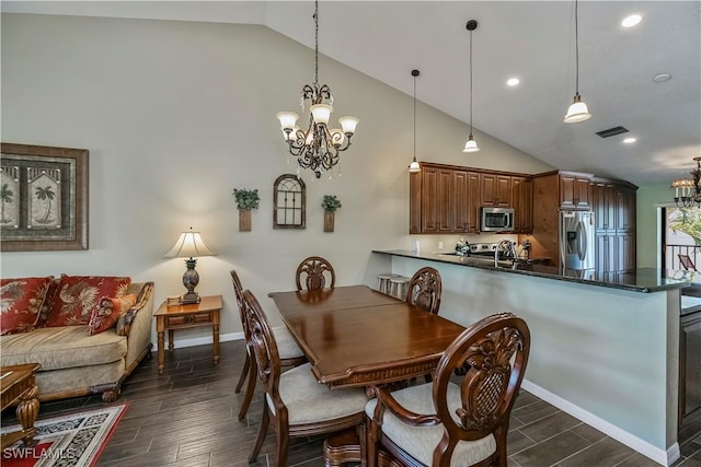 12090 Kelly Greens Blvd Unit 119, Fort Myers, FL 33908 - dining room with a chandelier, recessed lighting, visible vents, and wood tiled floor