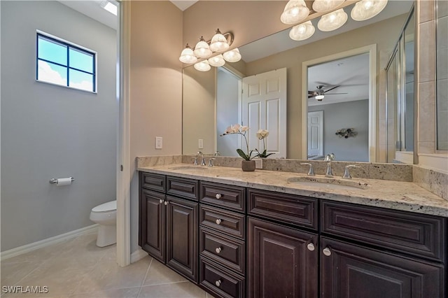 11296 Paseo Grande Blvd Unit 5806, Fort Myers, FL 33912 - full bathroom featuring toilet, tile patterned floors, double vanity, and a sink