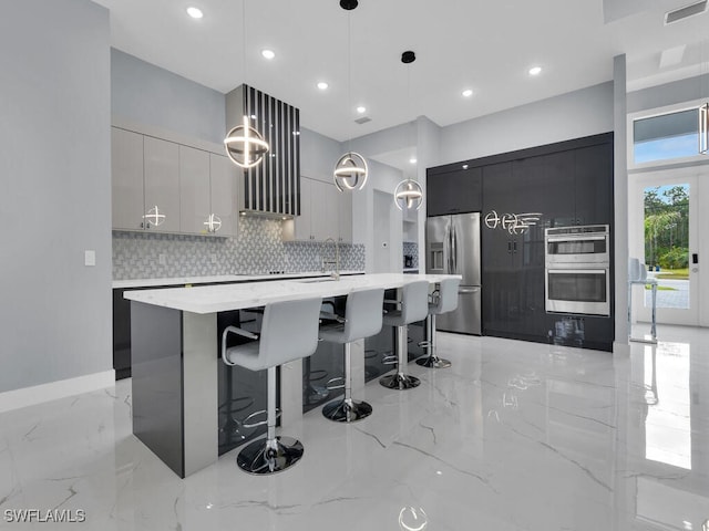 kitchen with marble finish floor, visible vents, modern cabinets, and appliances with stainless steel finishes