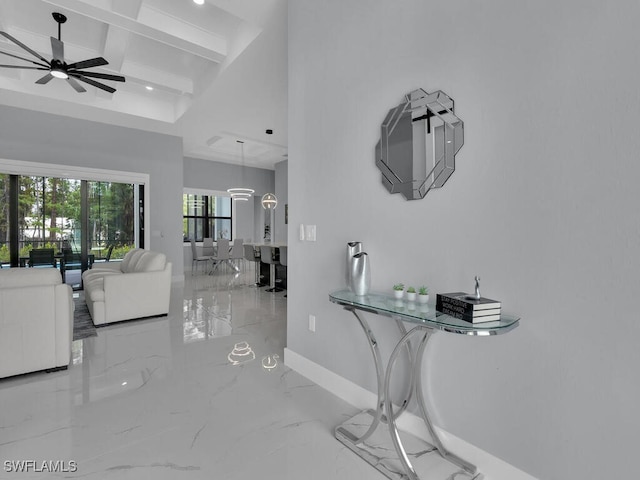 corridor with marble finish floor, baseboards, beam ceiling, and coffered ceiling