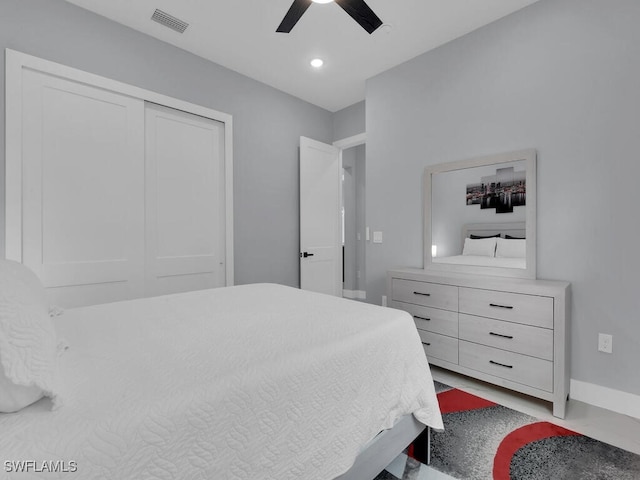 bedroom with visible vents, baseboards, a ceiling fan, and a closet