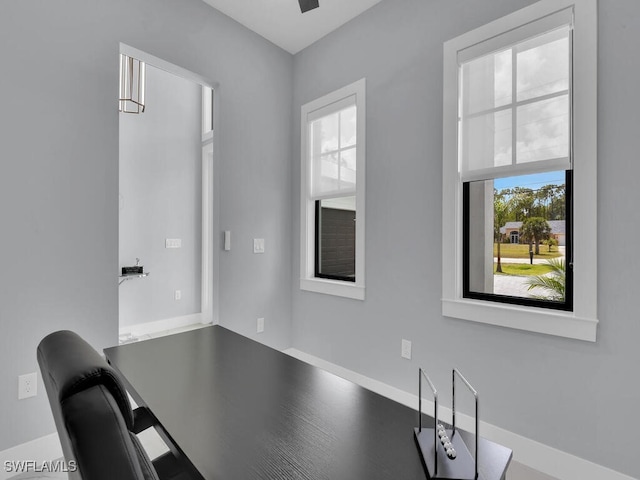 unfurnished office with baseboards