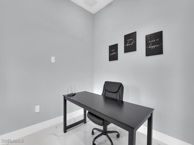 office with visible vents, marble finish floor, and baseboards