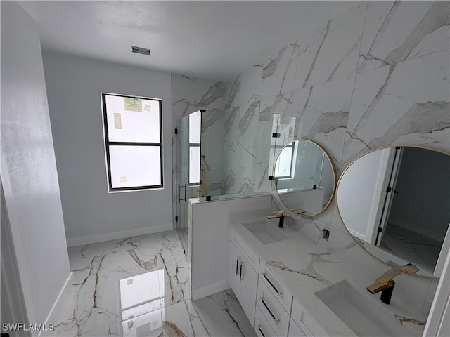 1603 E 5th St, Lehigh Acres, FL 33972 - full bath featuring marble finish flooring, baseboards, double vanity, and a marble finish shower