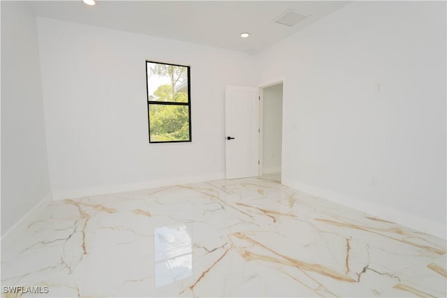 1603 E 5th St, Lehigh Acres, FL 33972 - spare room featuring marble tiled flooring, recessed lighting, and baseboards