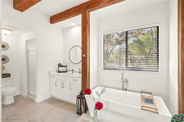 full bath featuring toilet, a healthy amount of sunlight, a freestanding bath, and a stall shower