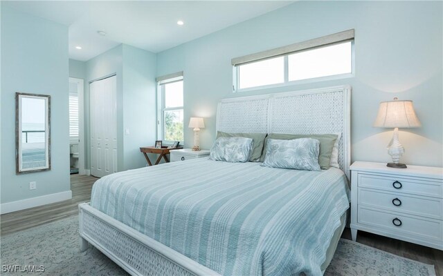 4620 Oro Pesos Ln, Upper Captiva, FL 33924 - bedroom featuring wood finished floors, baseboards, a closet, and recessed lighting