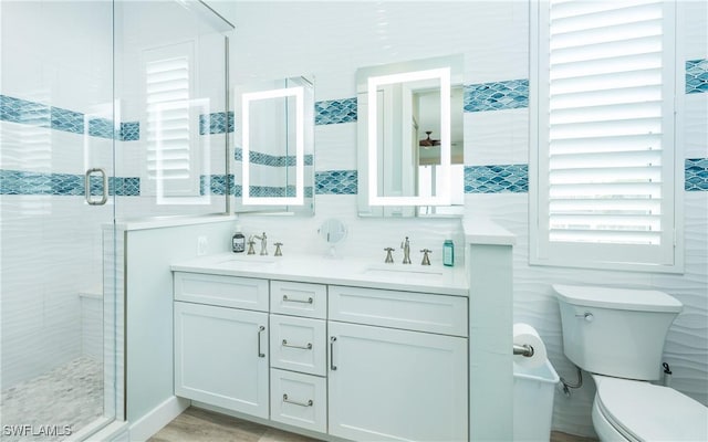4620 Oro Pesos Ln, Upper Captiva, FL 33924 - full bath featuring a stall shower, double vanity, and toilet