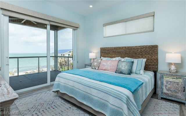 4620 Oro Pesos Ln, Upper Captiva, FL 33924 - bedroom featuring access to exterior, wood finished floors, a water view, and recessed lighting
