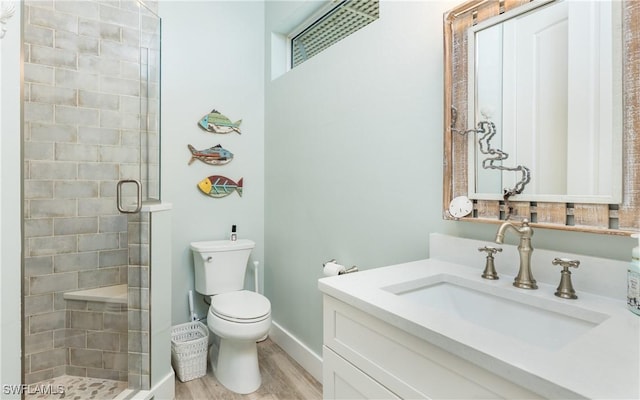 4620 Oro Pesos Ln, Upper Captiva, FL 33924 - full bathroom featuring vanity, a stall shower, wood finished floors, toilet, and baseboards