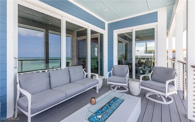 4620 Oro Pesos Ln, Upper Captiva, FL 33924 - sunroom with an outdoor living space with a fire pit