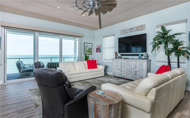 4620 Oro Pesos Ln, Upper Captiva, FL 33924 - living room with a ceiling fan, wood finished floors, wood ceiling, and baseboards
