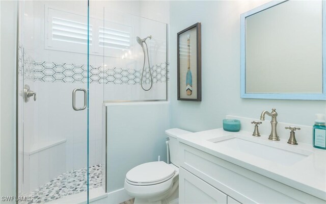 4620 Oro Pesos Ln, Upper Captiva, FL 33924 - full bath with a shower stall, vanity, and toilet