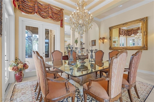 tiled dining area with crown molding, french doors, a notable chandelier, and baseboards