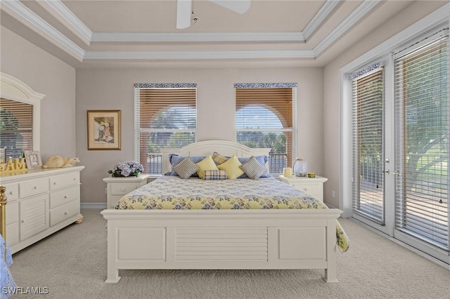 bedroom featuring crown molding, access to outside, a raised ceiling, and light carpet