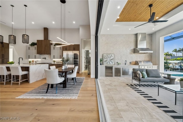 127 SW 56th Ter, Cape Coral, FL 33914 - interior space featuring recessed lighting, light wood-type flooring, a high ceiling, and a ceiling fan