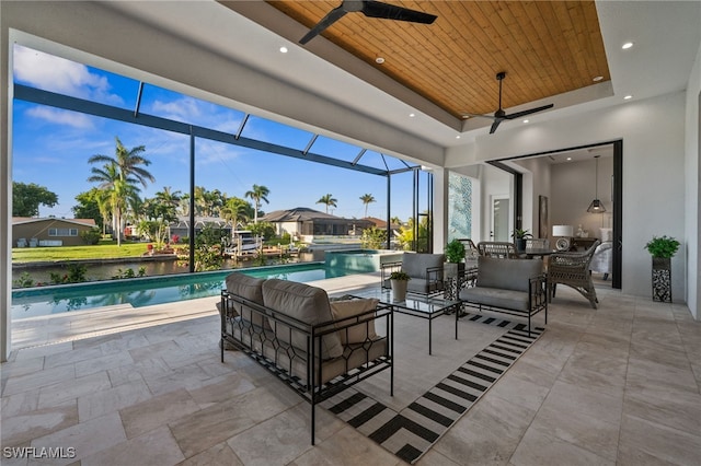127 SW 56th Ter, Cape Coral, FL 33914 - exterior space with a lanai, an outdoor living space, a ceiling fan, and a pool with connected hot tub