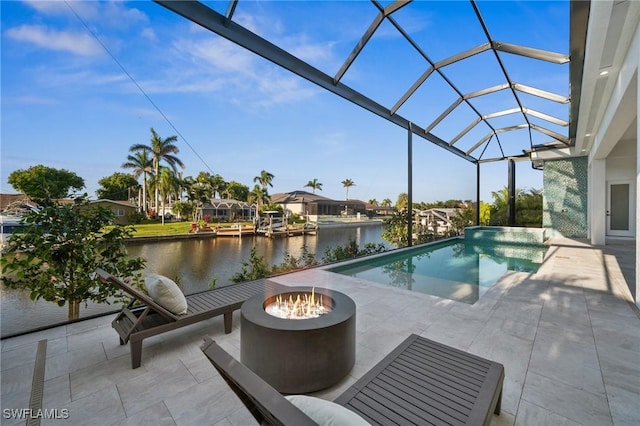 127 SW 56th Ter, Cape Coral, FL 33914 - pool with a fire pit, a water view, a patio area, and a lanai
