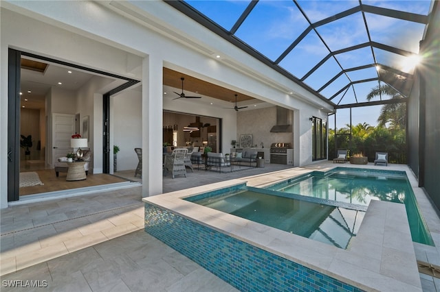 127 SW 56th Ter, Cape Coral, FL 33914 - view of swimming pool with a ceiling fan, area for grilling, exterior kitchen, glass enclosure, and a patio area