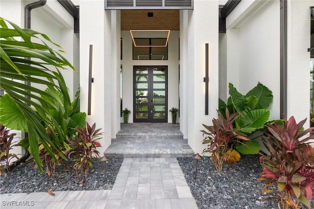 127 SW 56th Ter, Cape Coral, FL 33914 - entrance to property featuring stucco siding and french doors